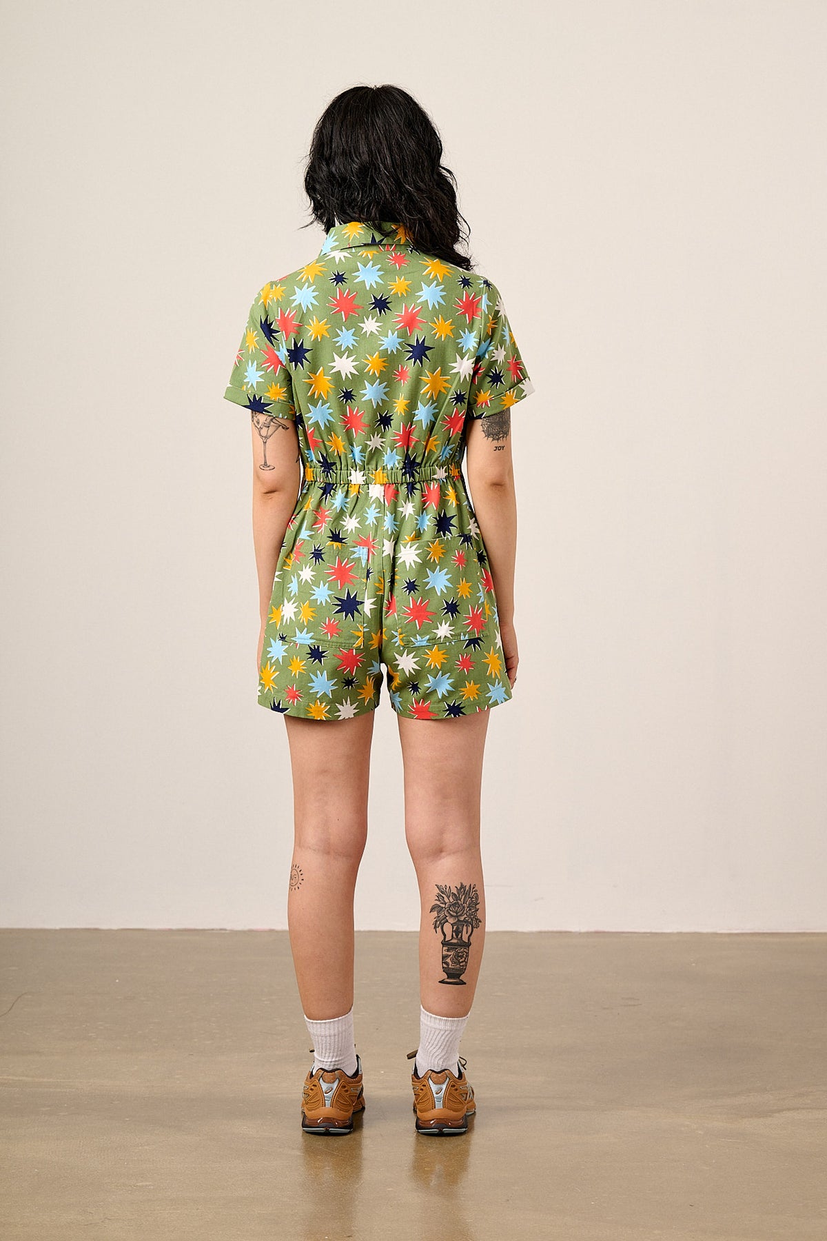 Riley - Short Sleeve Playsuit Organic Cotton Twill in Green Cosmic Folk Stars