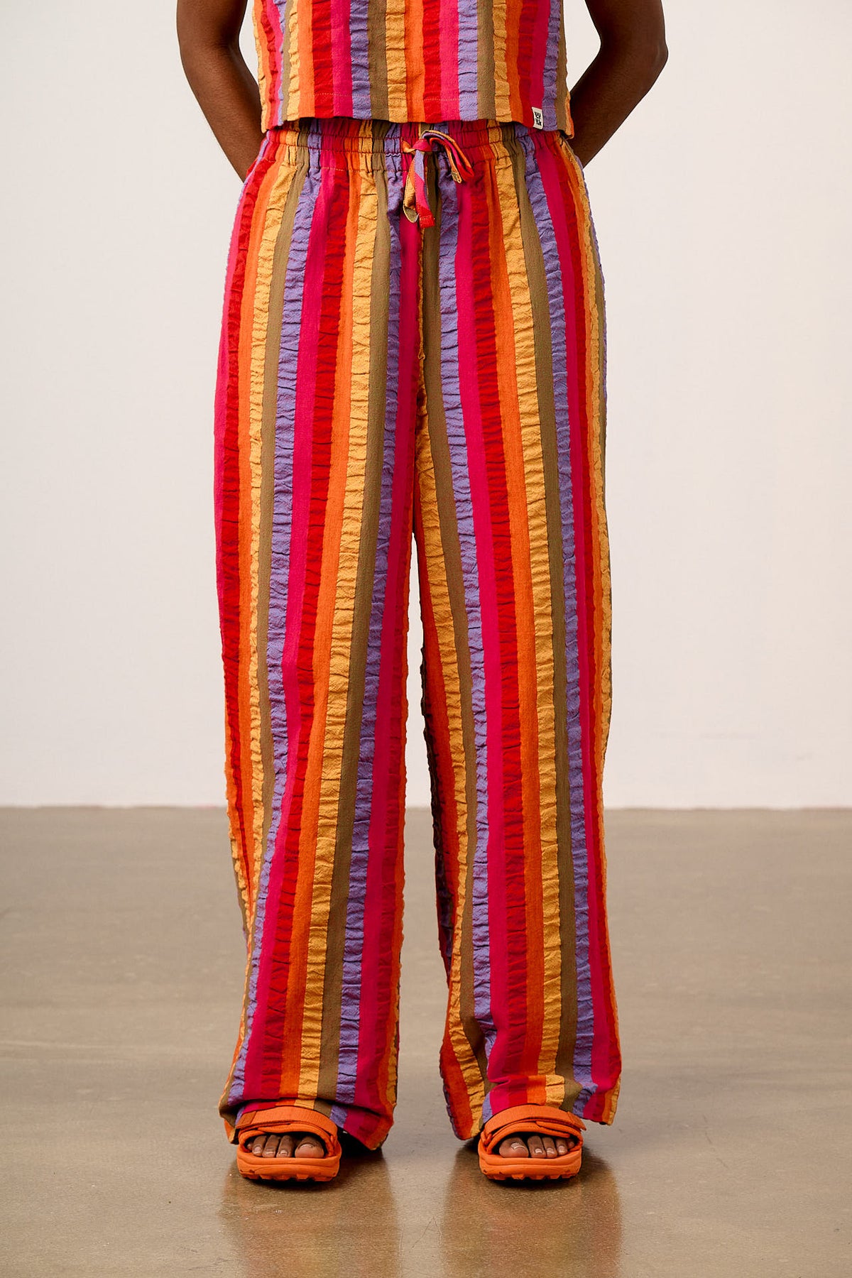 Norris - Wide Leg Trousers Organic Cotton Seersucker in Wide Rainbow Stripe