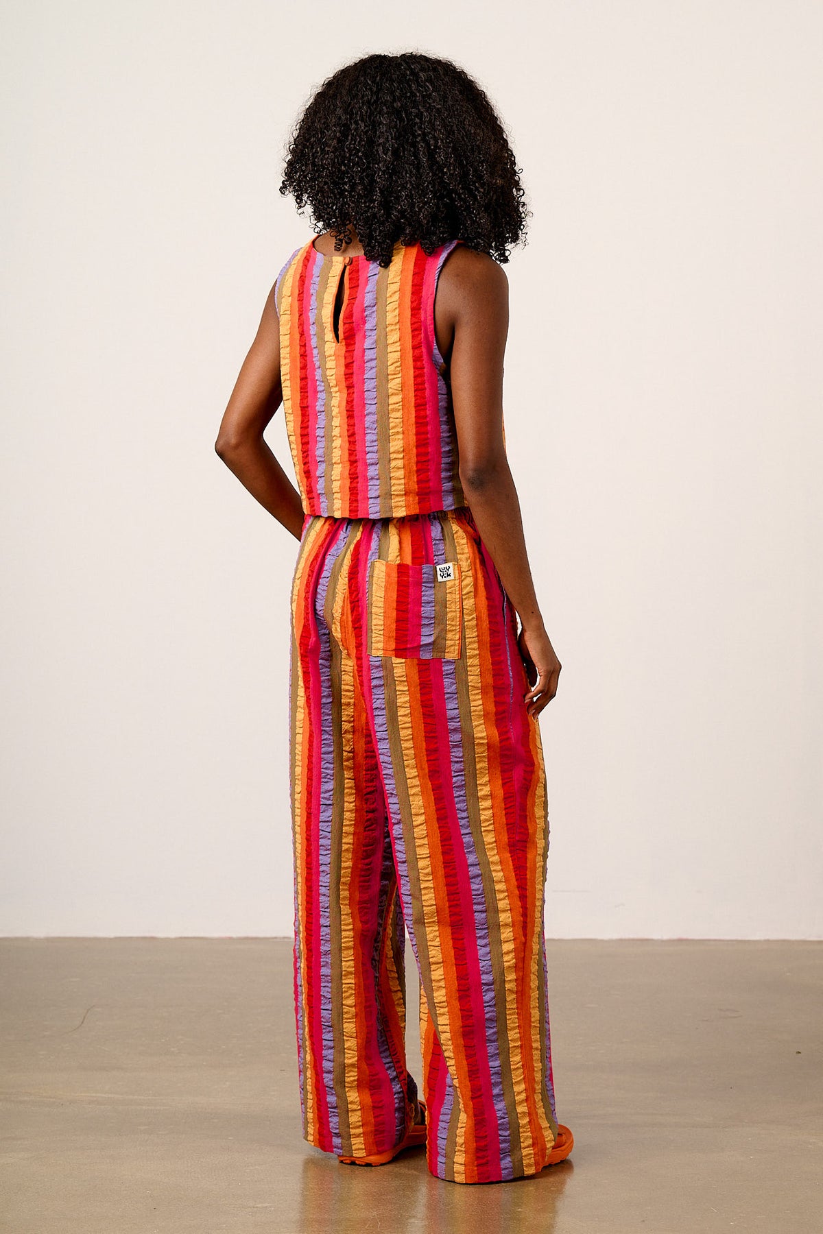 Norris - Wide Leg Trousers Organic Cotton Seersucker in Wide Rainbow Stripe