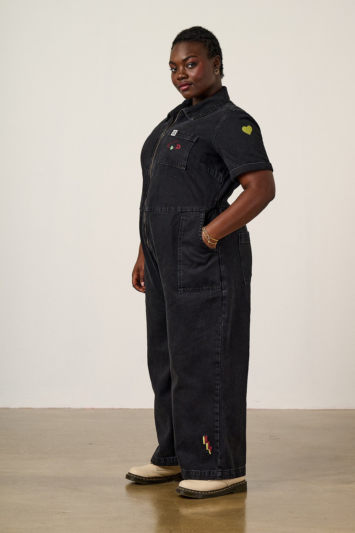 Ragan - Cropped Leg Jumpsuit Organic Cotton Denim in Washed Black with Punk Energy Patches