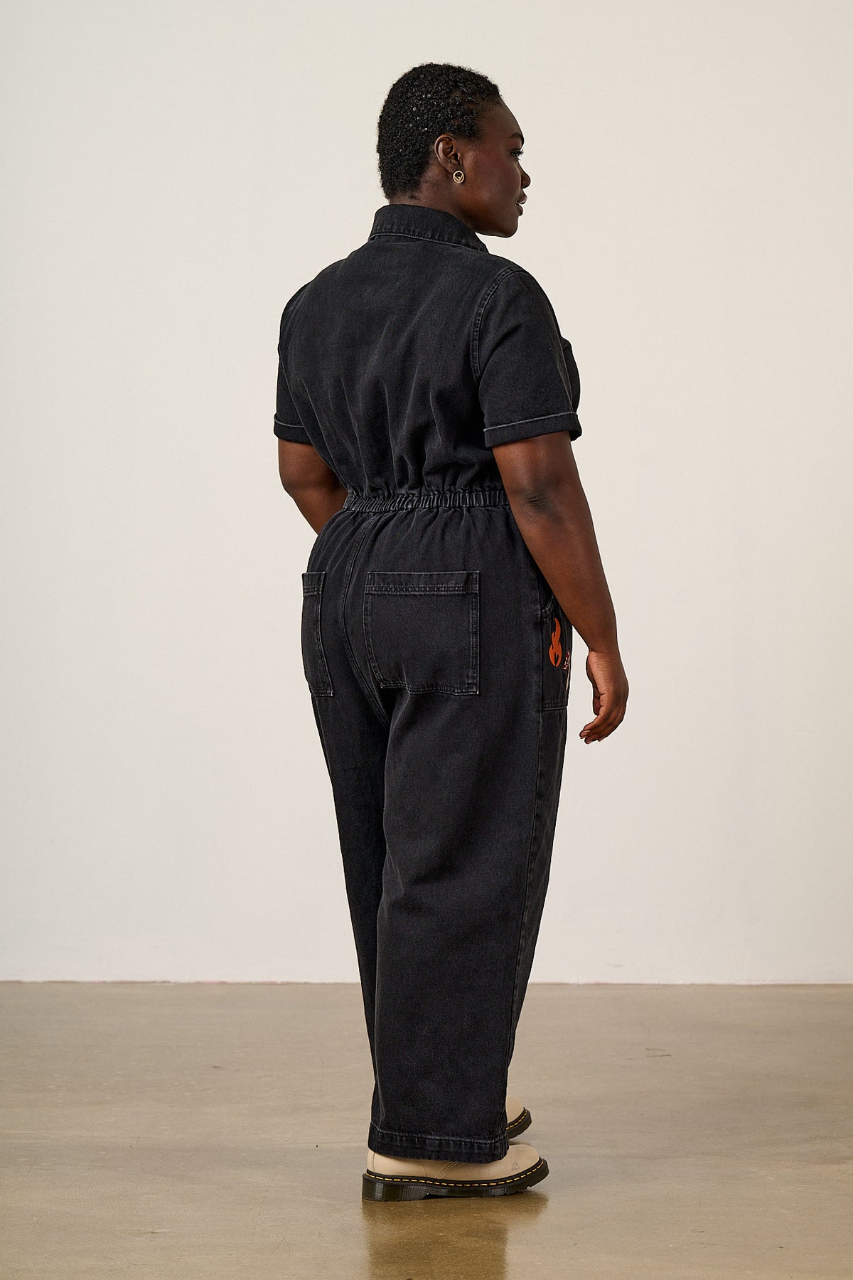 Ragan - Cropped Leg Jumpsuit Organic Cotton Denim in Washed Black with Punk Energy Patches