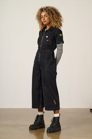 Ragan - Cropped Leg Jumpsuit Organic Cotton Denim in Washed Black with Punk Energy Patches