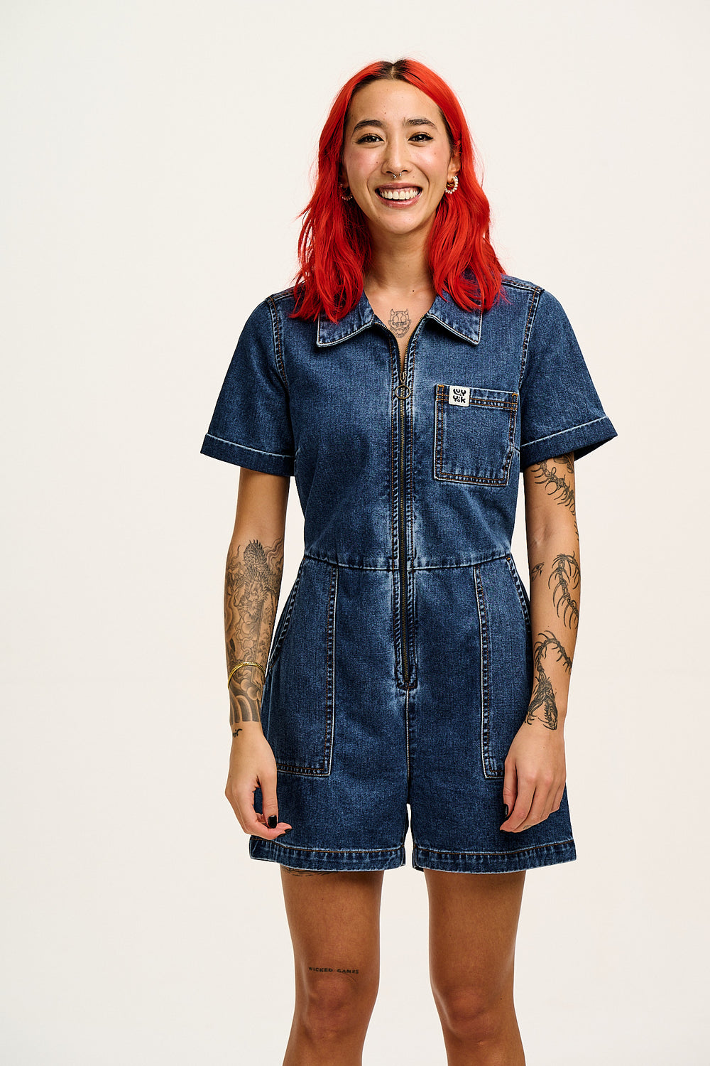 Riley - Short Sleeve Playsuit Organic Cotton Denim in Mid Wash Blue
