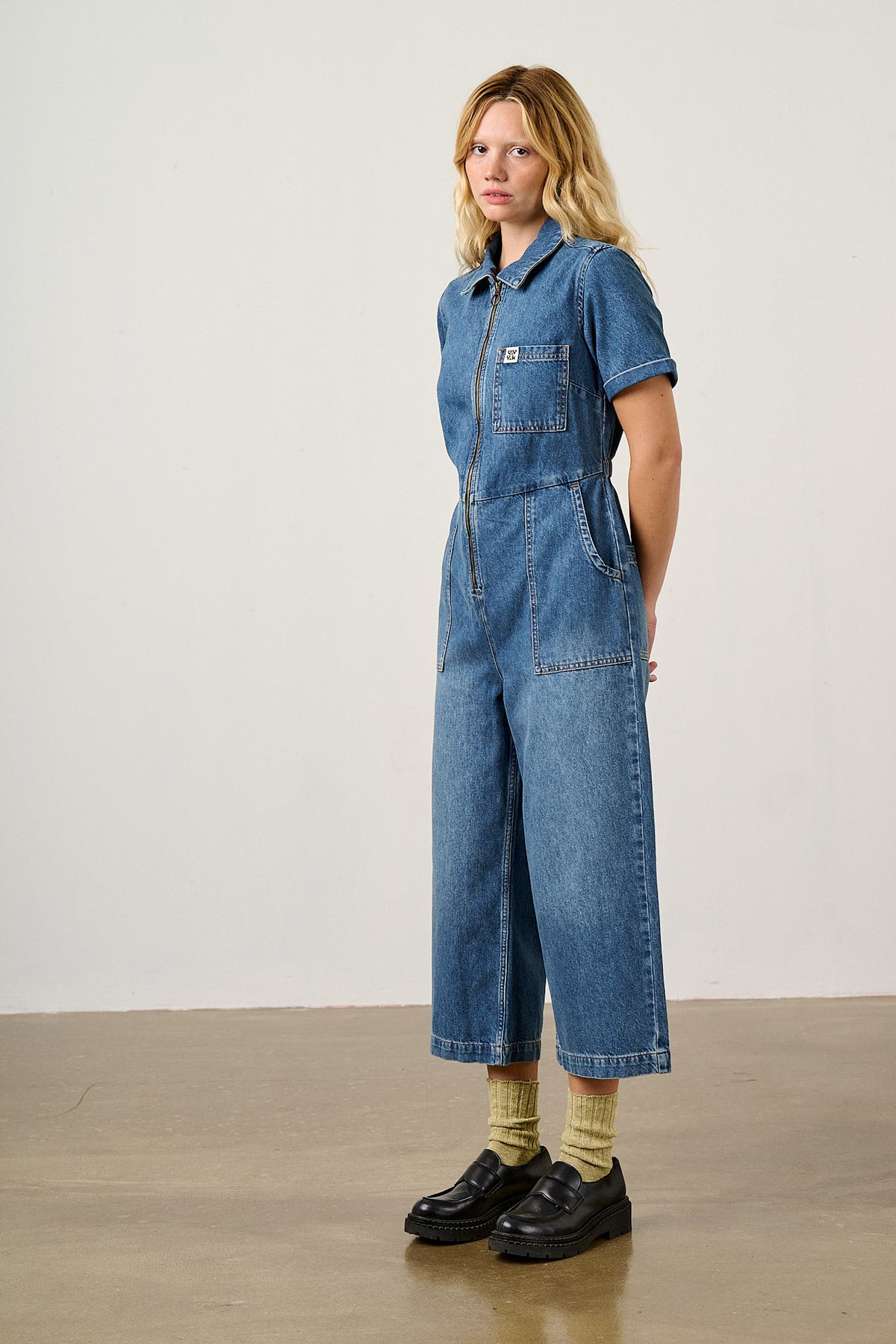 Ragan - Cropped Leg Jumpsuit Organic Cotton Denim in New Mid Wash Blue