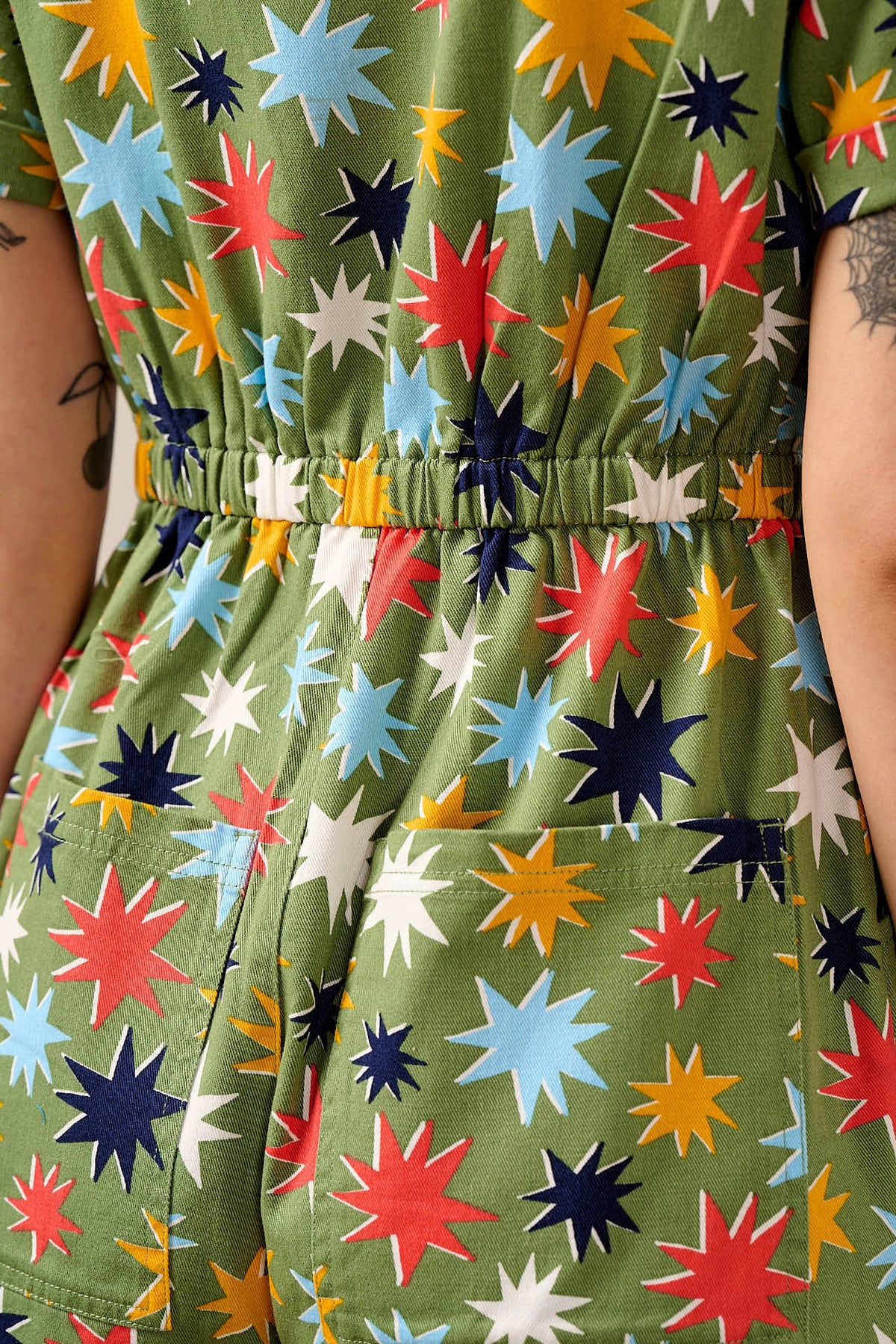 Riley - Short Sleeve Playsuit Organic Cotton Twill in Green Cosmic Folk Stars