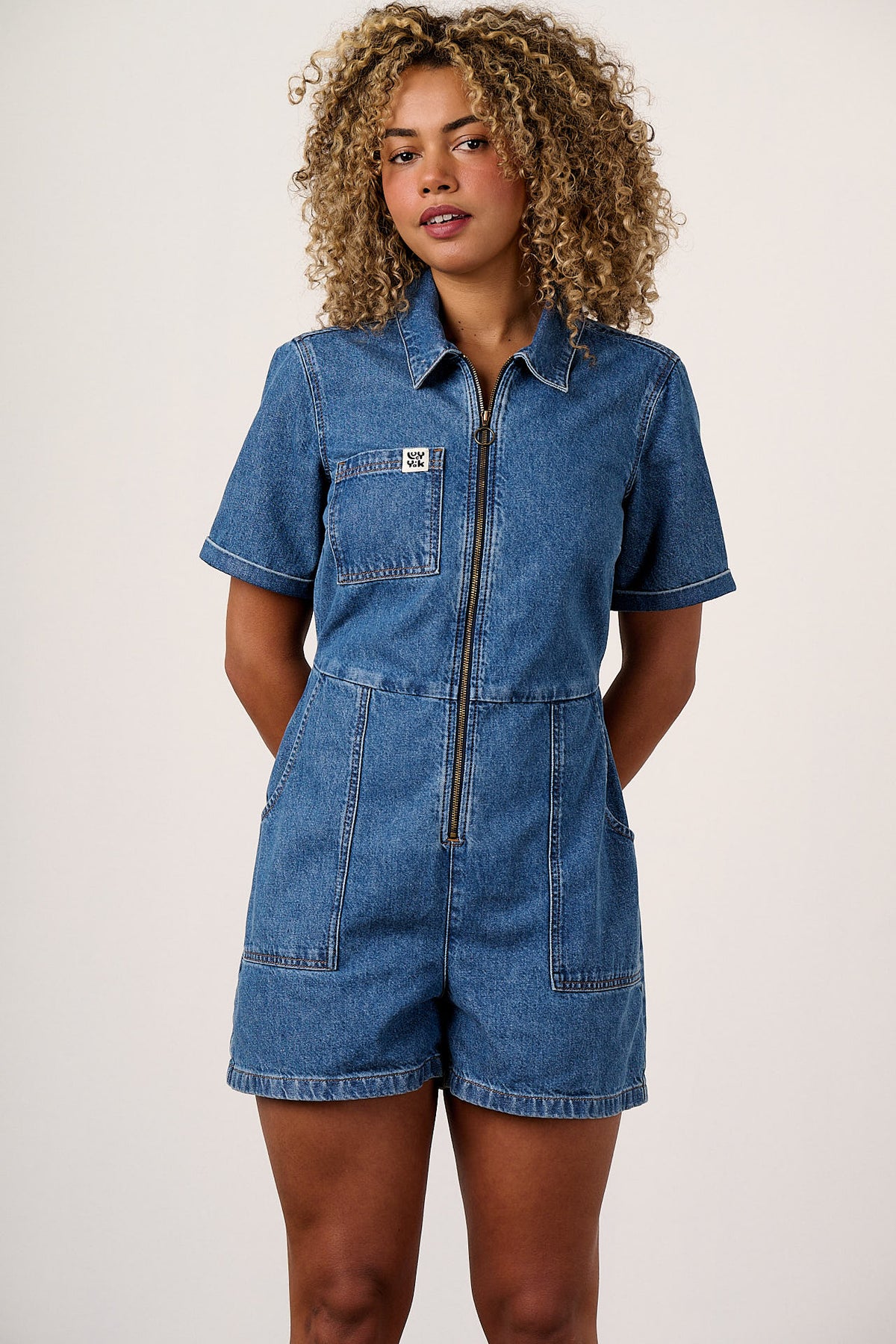 Riley - Short Sleeve Playsuit Organic Cotton Denim in Mid Wash Blue