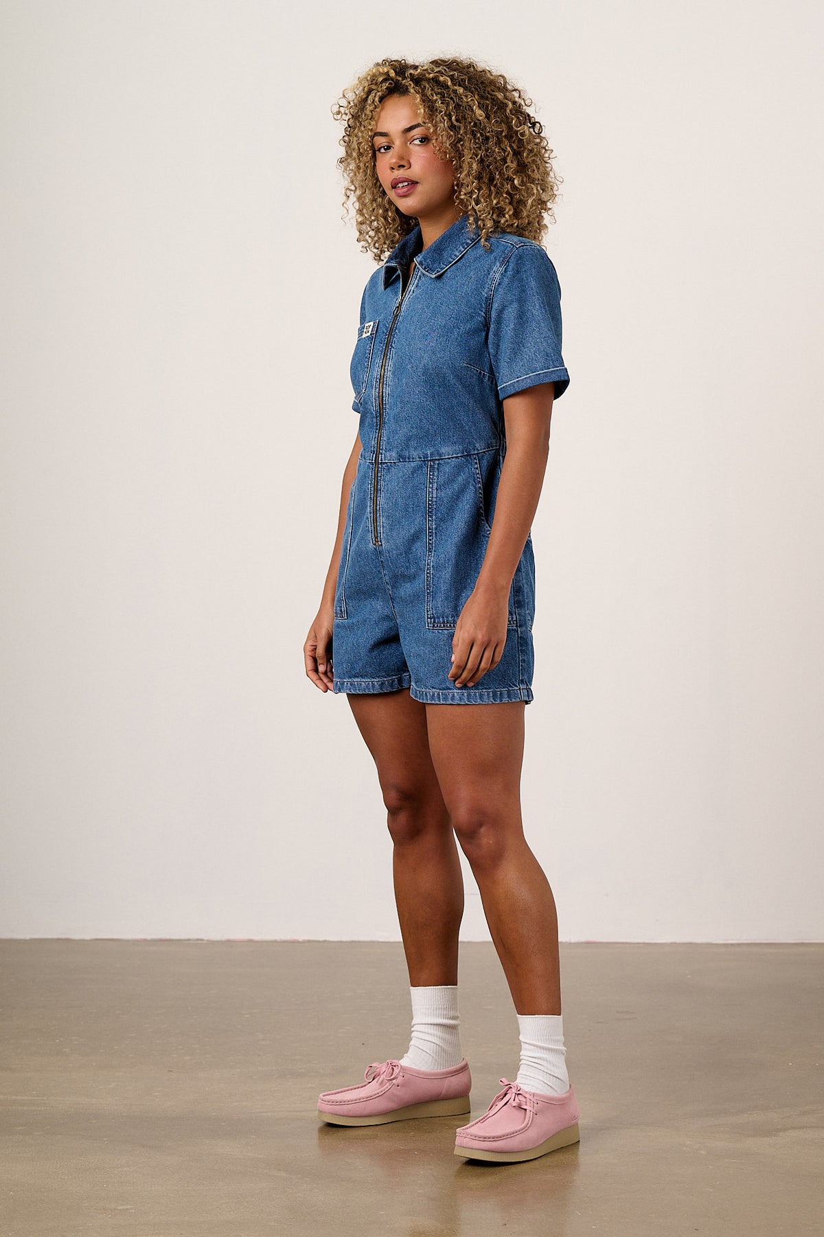 Riley - Short Sleeve Playsuit Organic Cotton Denim in Mid Wash Blue