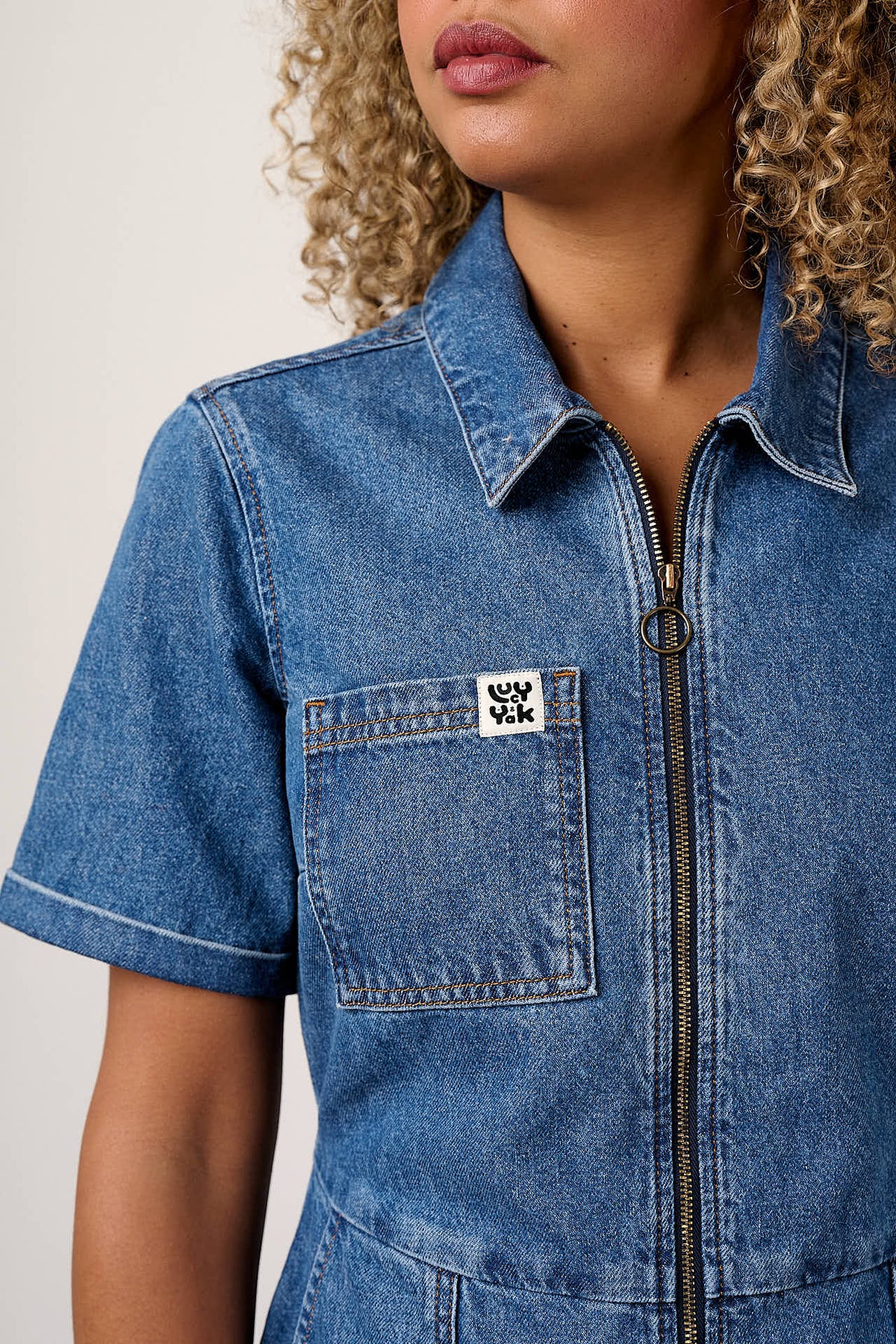 Riley - Short Sleeve Playsuit Organic Cotton Denim in Mid Wash Blue